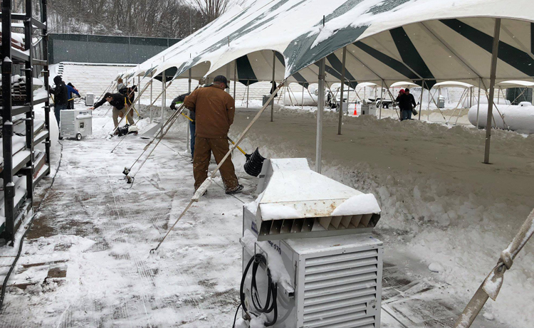 Premier portable forced air heaters being setup outside an emergency tent.